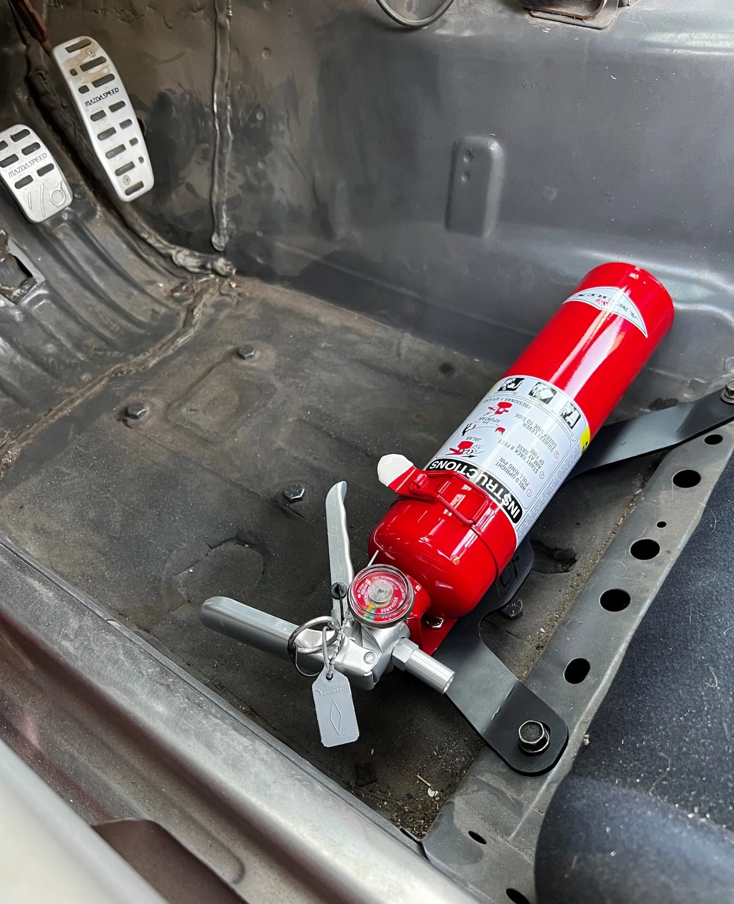 Soporte para extintor de incendios Miata